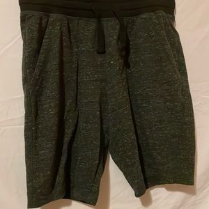 Dark gray shorts with black drawstring waist.